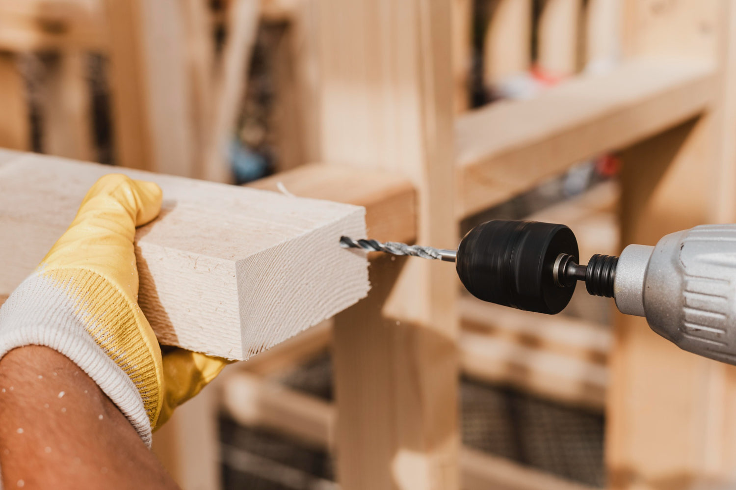 close-up-person-holding-hammer-drill