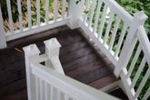 Image is a well secured railing on a timber deck