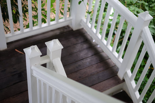 Image is a well secured railing on a timber deck