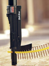 Quik Drive screw gun with a close-up of screws on a blurred background