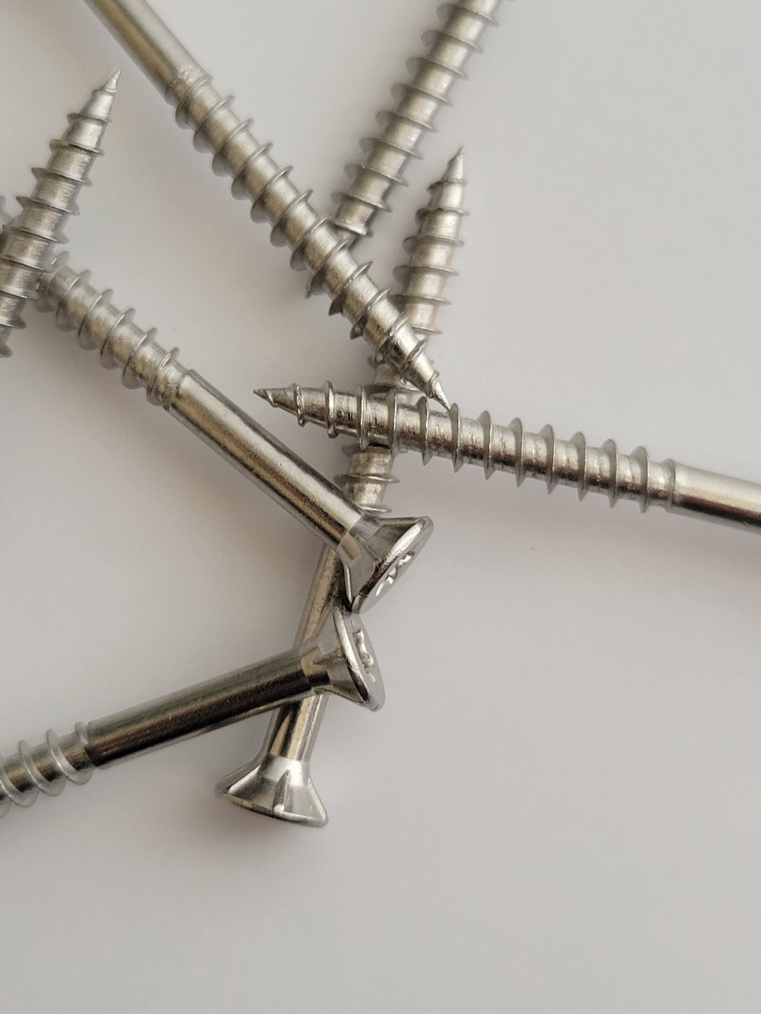 Wood screws with nibs under the head