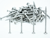 Pile of screws on a white background
