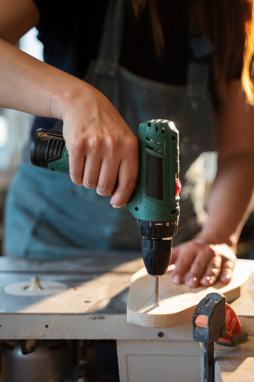 front-view-woman-working-with-drill
